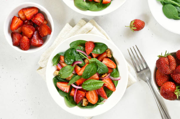istock Salad with strawberry, red onion and spinach 1307563656