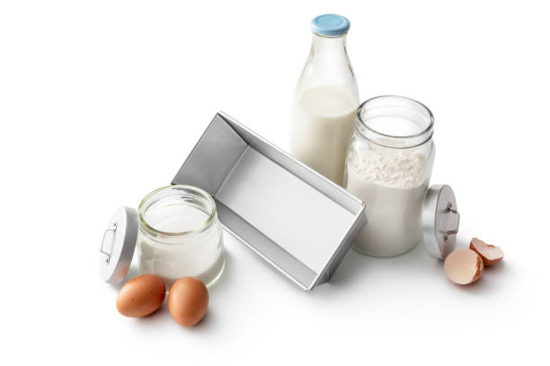 istock Baking Ingredients: Flour, Sugar, Milk and Eggs Isolated on White Background 1307564074