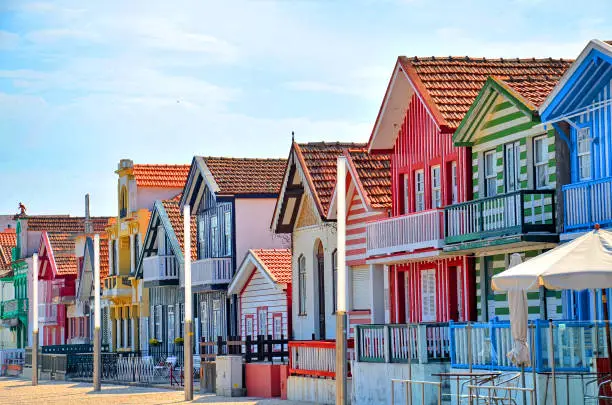 Photo of Portugal, Costa Nova. Fisherman's village with striped, decorated houses, which line the main promenade. Located on a spit of land linked to mainland Portugal by a bridge, about 11km west of Aveiro.