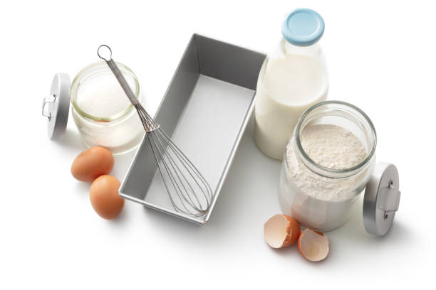 istock Baking Ingredients: Flour, Sugar, Milk and Eggs Isolated on White Background 1307564100