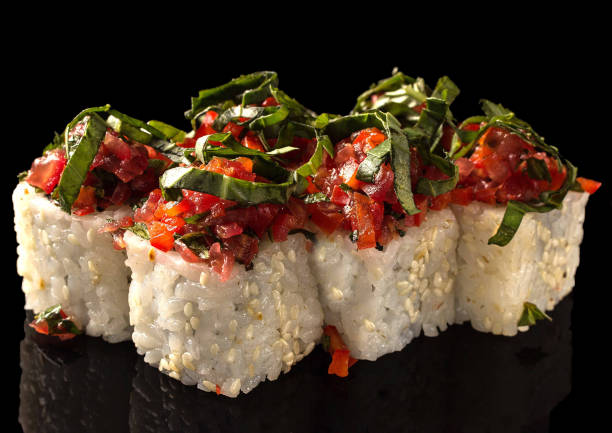 istock Traditional Japanese sushi with fresh seafood on a black background 1307565603