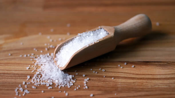 istock Sea salt in a wooden spatula. 1307566287