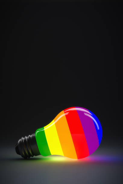 istock LGBT theme illustration. The rainbow light bulb is glowing. Copy space. 1307567221