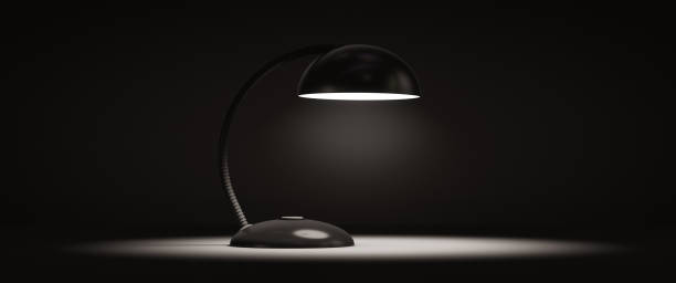 istock The table lamp is shining. Dark room. Copy space. 1307567238
