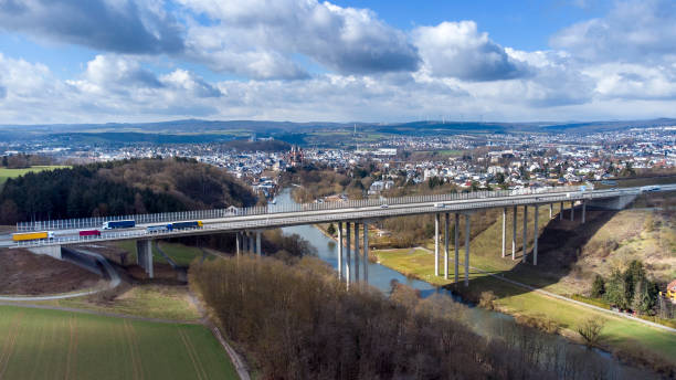 istock Highway and railroad bridge - aerial view 1307569470