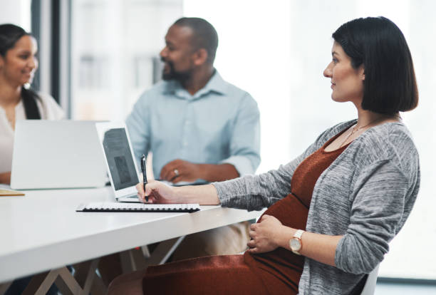 istock Juggling business with a bun in the oven 1307569631