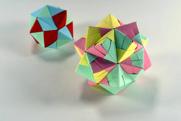 istock Self-made colorful origami star cube on white background. 1307571209