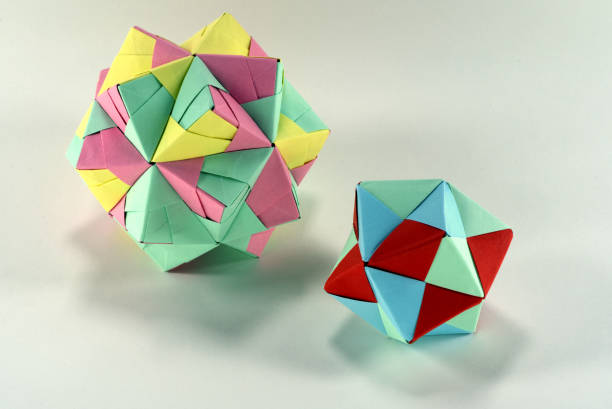 istock Self-made colorful origami star cube on white background. 1307571248
