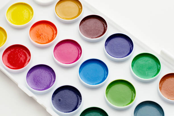 istock Watercolour paints and a palette on a white background. 1307571563