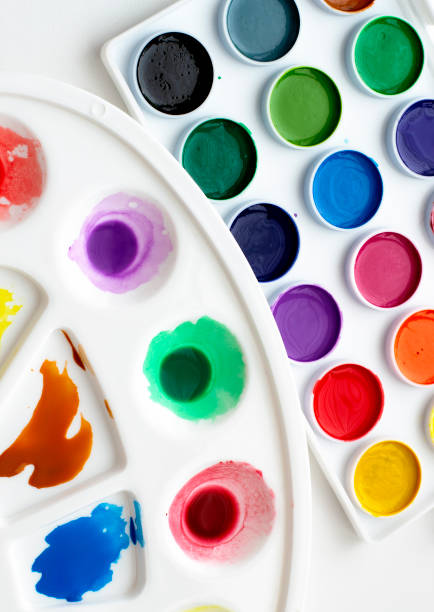 istock Watercolour paints and a palette on a white background. 1307571564