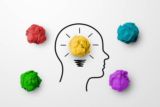 istock Concept creative idea and innovation. Paper scrap ball yellow colour outstanding different group with light bulb and head human symbol 1307573128