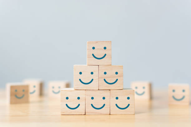 Wooden cube block shape with icon face smiley, The best excellent business services rating customer experience, Satisfaction survey concept Wooden cube block shape with icon face smiley, The best excellent business services rating customer experience, Satisfaction survey concept admiration stock pictures, royalty-free photos & images