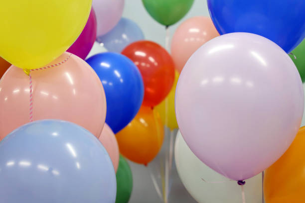 istock Helium balloons with ribbons in the office 1307573795