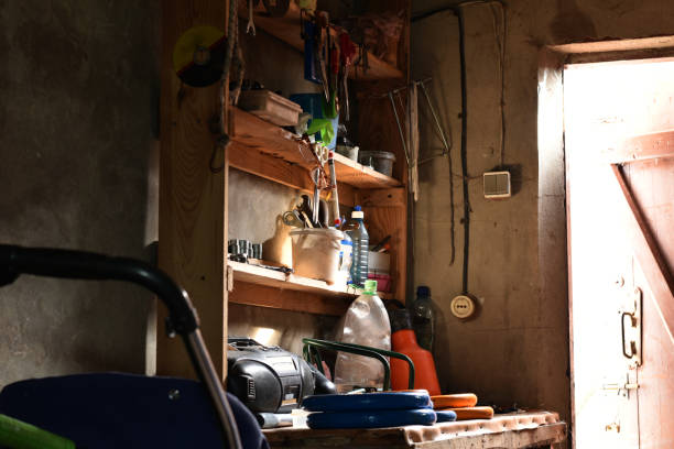 istock A shelving in a shed and a tool is illuminated by a beam of light. 1307574881