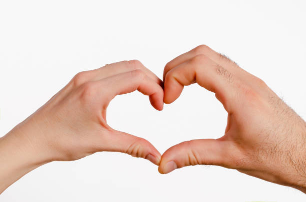 istock Male and female hands forming a heart 1307577125