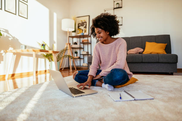 istock Young African American woman attending online seminar and e-learning 1307577536
