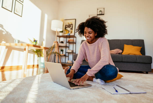 istock Young African American woman attending online seminar and e-learning 1307577579