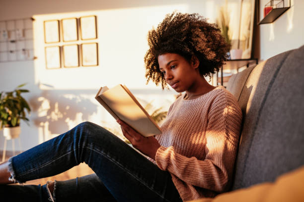 istock African student reading book at home 1307577677