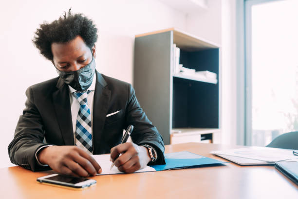 istock Businessman working at office. 1307578787