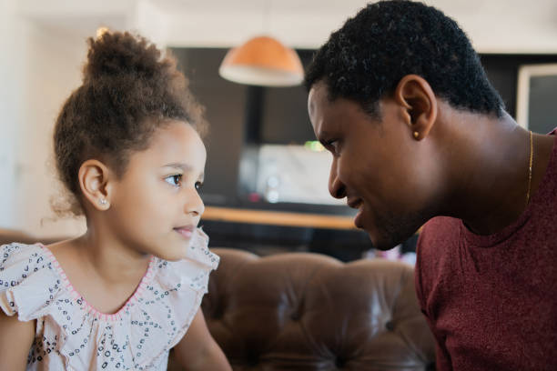 istock Daughter and father playing together at home. 1307578823