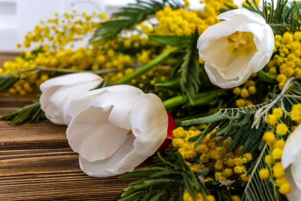 istock Spring flowers bouquet - Yellow Mimosa and White Tulips 1307579909