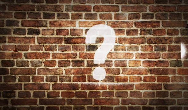 istock Question mark symbol spray painted on the brick wall 1307580511