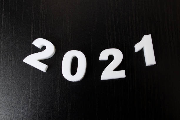 istock White numbers 2021 on black background, new year 1307581681