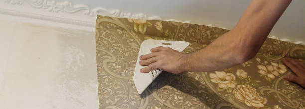 istock Wallpapering repair work. Selective focus. interiors nature 1307581913