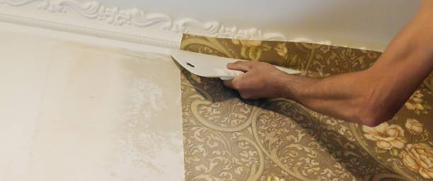 istock Wallpapering repair work. Selective focus. interiors nature 1307581916
