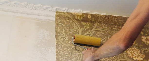 istock Wallpapering repair work. Selective focus. interiors nature 1307581919