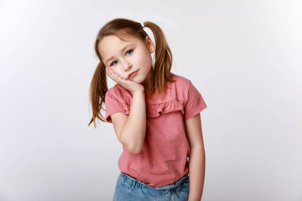 istock Little girl suffering from toothache 1307582803