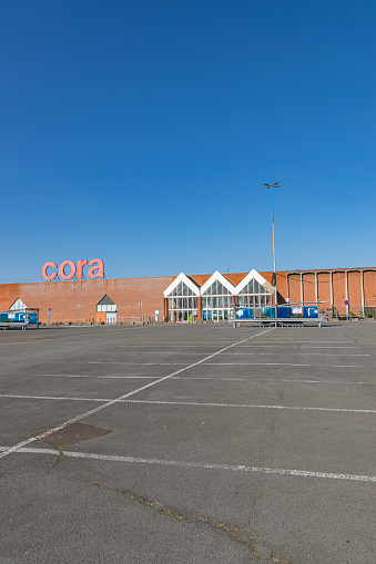 Villeneuve d'Ascq,FRANCE-February 28,2021: View of Cora hypermarket,entrance and parking.Cora is a Belgian international supermarket chain. Cora was founded in 1974.