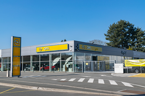 Villeneuve d'Ascq,FRANCE-February 28,2021: Opel brand dealership store.Opel Automobile GmbH is a German company dealing in the production of passenger vehicles and delivery vans, founded on 1862.