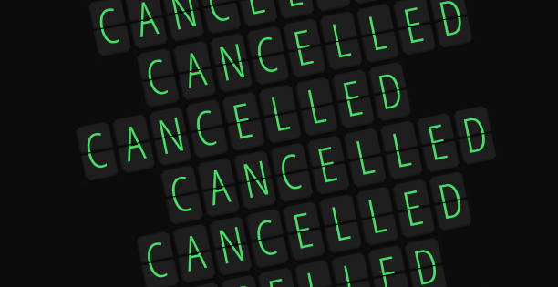 Airport table sign concept with word cancelled on dark black background Angled sign of cancelled flight departure digital table idea for multi purpose usage delayed sign photos stock pictures, royalty-free photos & images