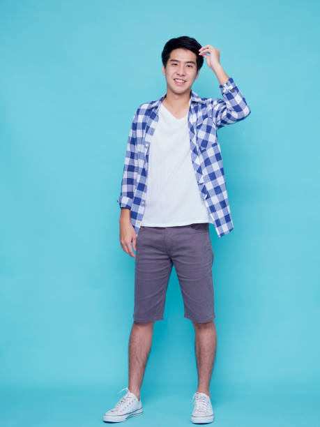 istock Asian handsome man posing on blue background. 1307585775