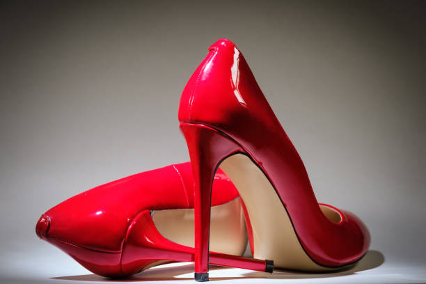 istock beautiful female shiny red stilettos 1307587036