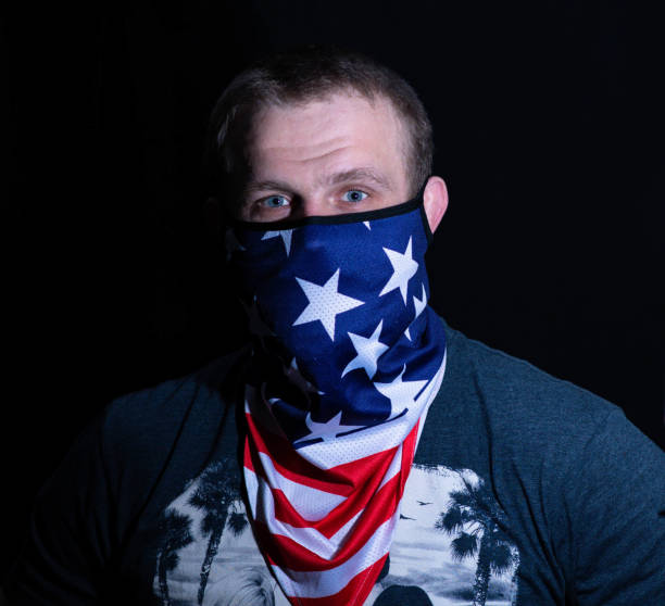 istock Masked man portrait looking at the camera 1307588204