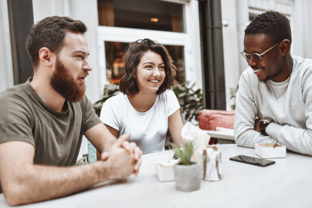 istock Three Multiethnic Friend Smiling While Spending Time Together In Restaurant 1307591081