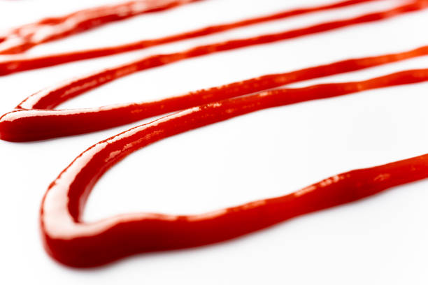 istock Tomato ketchup on white background 1307591766