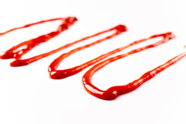 istock Tomato ketchup on white background 1307591819
