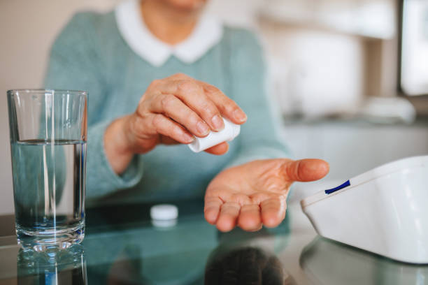istock Senior woman- preparation checking blood presure 1307591900