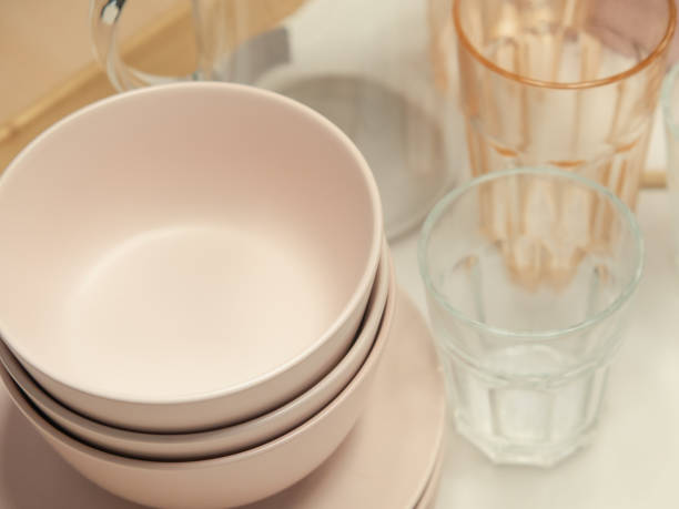Plastic bowls and water glasses set for kitchen utensils.