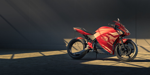 A generic electric motorbike with generic red and white decals on its stand alone in a large garage or warehouse with concrete walls and floor. The bike is lit by shafts of light coming from skylights in the roof. With plenty of copy space.