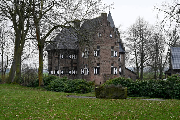 Korschenbroich, Germany, March 10, 2021 - Haus Fuerth in the Liedberg district of Korschenbroich in the Rhine district of Neuss is the only surviving Rhineland moated castle of half-timbered construction.