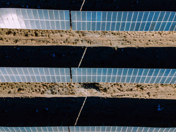 istock Drone Point View of Solar Panels in Desert 1307597750