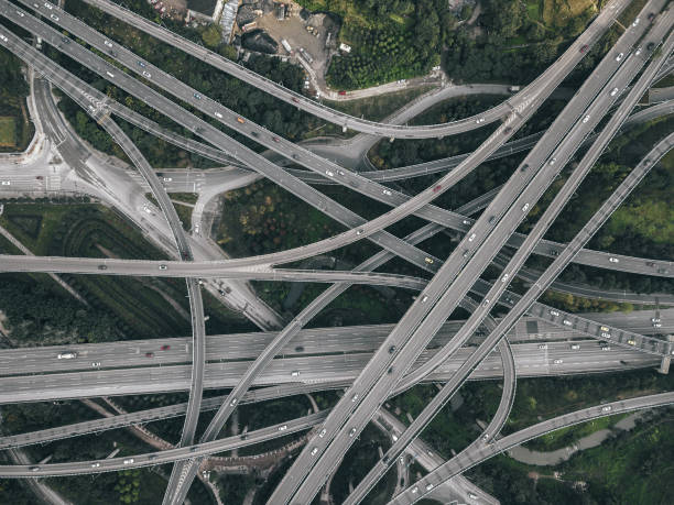 istock Aerial View of Complex Overpass and Busy Traffic 1307597757
