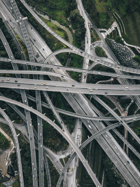 istock Aerial View of Complex Overpass and Busy Traffic 1307598370