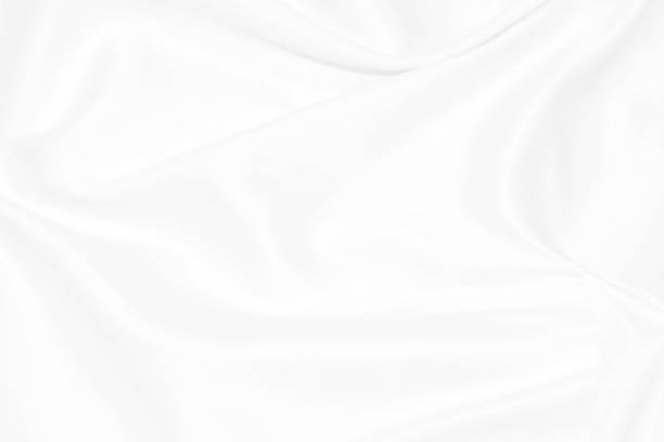 istock Clean woven fashion soft fabric white abstract smooth curve shape decorative textile background 1307598420