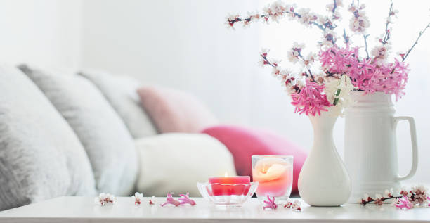istock spring pink flowers in vase in white interior 1307598482