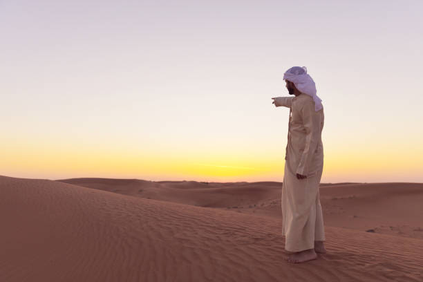 istock The Way Forward - Arab visiting dunes of Dubai 1307598733